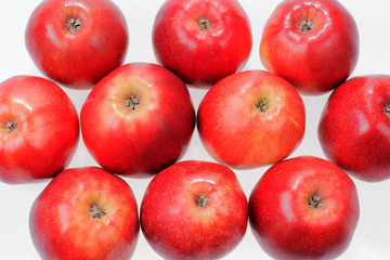 Close up view of some red apples isolated on white background
