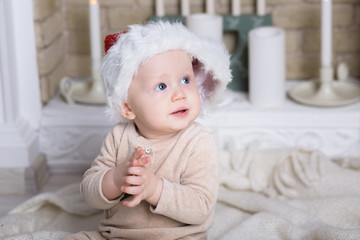 photo of cute baby in Santa hat