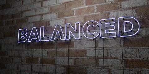 BALANCED - Glowing Neon Sign on stonework wall - 3D rendered royalty free stock illustration.  Can be used for online banner ads and direct mailers..