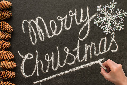 Merry Christmas hand writes on the chalk board - Powered by Adobe