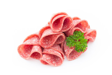 Salami sausage slices isolated on white background.