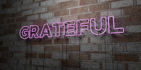 GRATEFUL - Glowing Neon Sign on stonework wall - 3D rendered royalty free stock illustration.  Can be used for online banner ads and direct mailers..