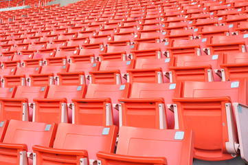 Naklejka premium Empty orange seats at stadium,Rows of seat on a soccer stadium