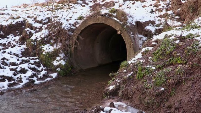 Drainage, concrete pipe spilling out water
