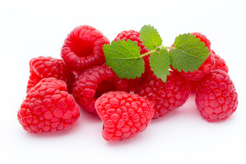 Ripe raspberry with leaf isolated on the white background.