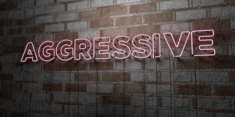AGGRESSIVE - Glowing Neon Sign on stonework wall - 3D rendered royalty free stock illustration.  Can be used for online banner ads and direct mailers..