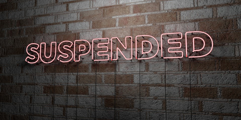 SUSPENDED - Glowing Neon Sign on stonework wall - 3D rendered royalty free stock illustration.  Can be used for online banner ads and direct mailers..