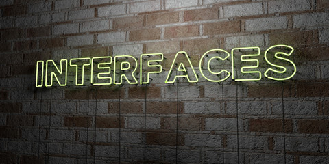 INTERFACES - Glowing Neon Sign on stonework wall - 3D rendered royalty free stock illustration.  Can be used for online banner ads and direct mailers..