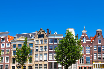 Fototapeta na wymiar Row of typical houses in downtown Amsterdam, the Netherlands