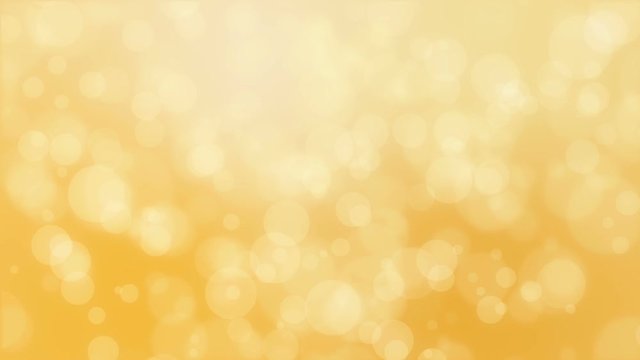 Blurred bokeh background with floating circle particles against a golden yellow backdrop.