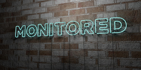 MONITORED - Glowing Neon Sign on stonework wall - 3D rendered royalty free stock illustration.  Can be used for online banner ads and direct mailers..
