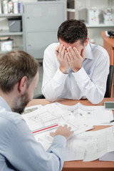 Obraz premium Stressed architect can't catch a break