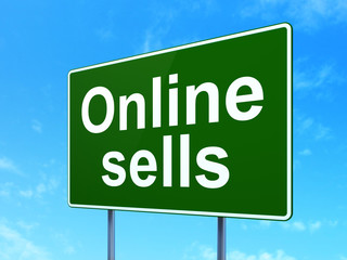 Marketing concept: Online Sells on road sign background
