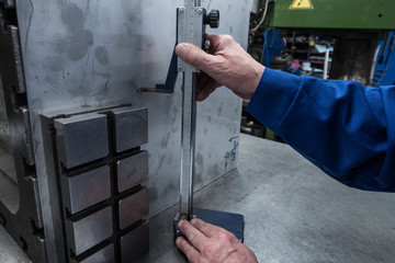 measurements of a steel plate using a planer