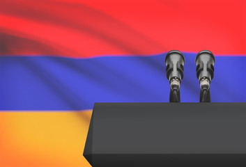 Pulpit and two microphones with a national flag on background - Armenia
