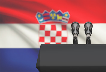 Pulpit and two microphones with a national flag on background - Croatia