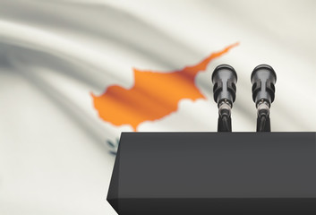 Pulpit and two microphones with a national flag on background - Cyprus