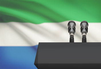 Pulpit and two microphones with a national flag on background - Sierra Leone
