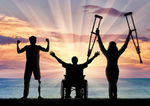 Happy three disabled and sea sunset