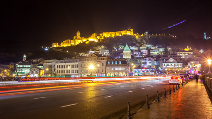 Fototapeta premium Aerial night view of Old Tbilisi, Georgia with Illuminated churc