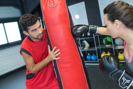 Cute Young Brunette Getting Boxing Lessons From Coach