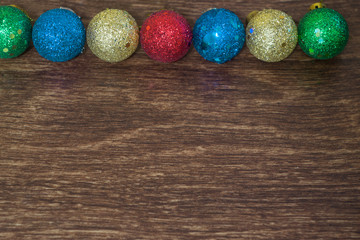 colored Christmas balls on a board