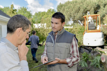 Foreman explaining something to a colleague