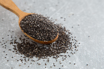 Chia seeds in a wooden spoon. Superfood, healthy concept