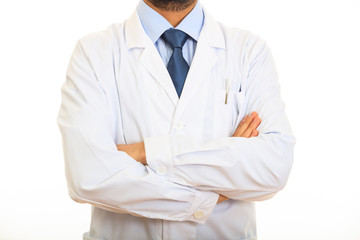 Doctor with crossing arms on white background