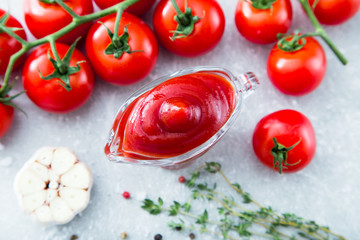Tomato ketchup sauce with garlic, spices and herbs with cherry t