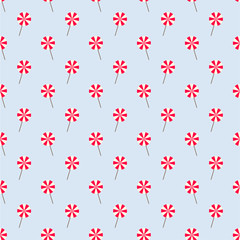 Light Blue Seamless Pattern with Red and White Lollipops