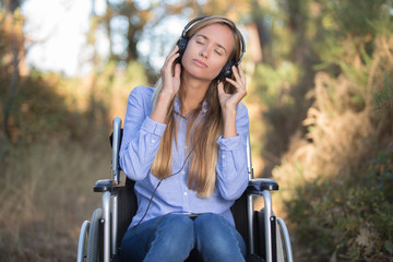 beautiful woman listening to music outside
