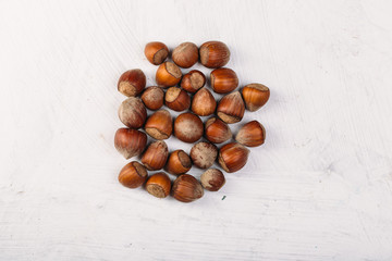 hazelnut kernel on a white texture table