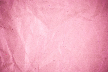 Fototapeta premium Pink crumpled recycle paper background.