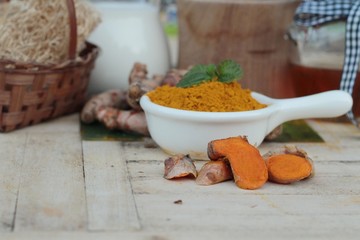 Turmeric powder with honey and milk for scrub.