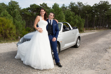 couple wedding day with convertible old car