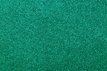 Focused emerald texture glitter background