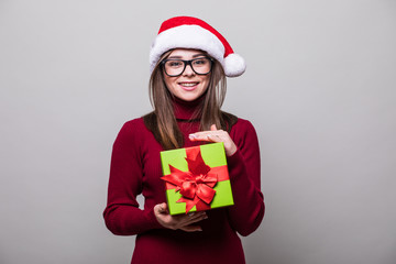 Woman with Christmas hat hold christmas gift