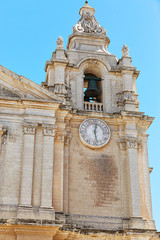 Old bell tower under blue sky