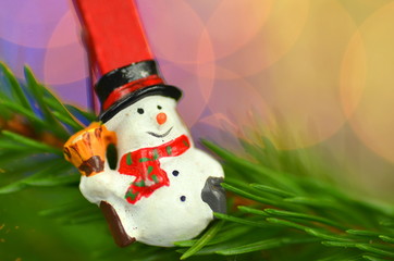 christmas decoration, snowman on clip against bokeh background