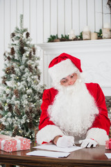 Portrait of Santa Claus answering Christmas letters