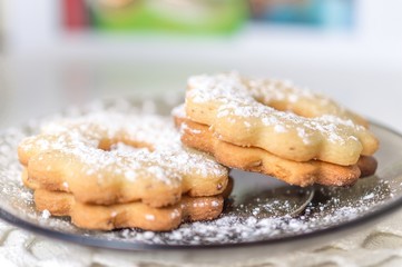 Homemade apricot jam Linzer with icing sugar close up
