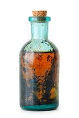 Bottle of herbal infusion or essential oil closeup on white.