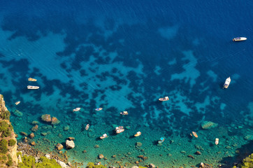 Fototapeta na wymiar Capri island, Italy, yachts on blue cleanest water