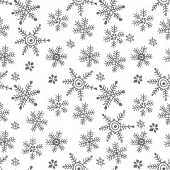 Seamless vector background with hand-drawn snowflakes. Monochrome winter background.