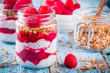 chia pudding with raspberry sauce, granola and fresh raspberries