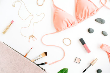 female summer bikini swimsuit and accessories collage on white with palm branches, necklace and lipstick. flat lay, top view