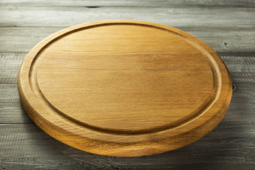 pizza cutting board at rustic background