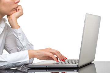 Closeup of business woman hand typing on laptop keyboard
