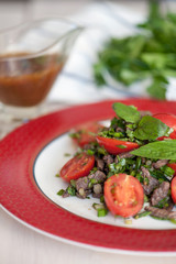 Strips of roast beef and sauteed vegetables